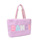 Side view of a purple sherpa large tote bag with glitter bubble letters 'DANCE ' applique