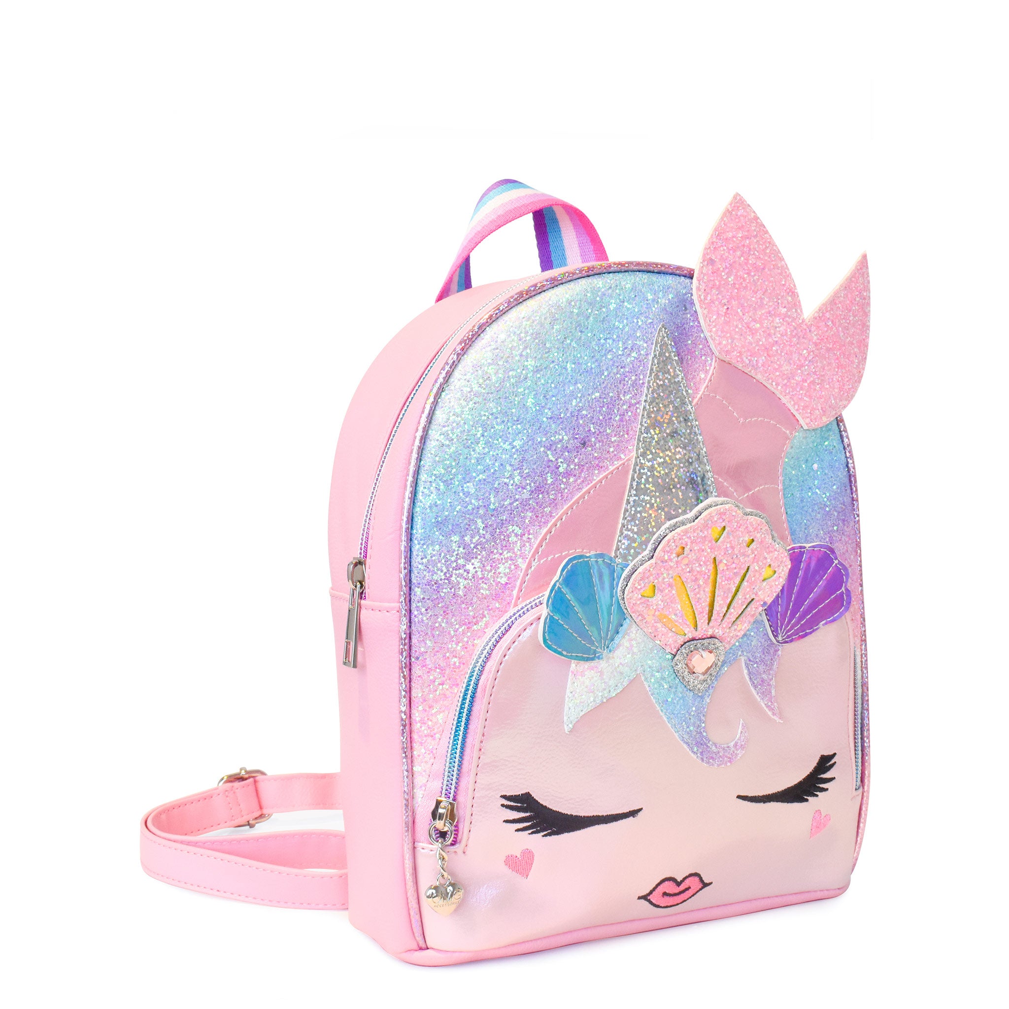 Side view of a unicorn mermaid mini backpack in an ombre glitter , embellished with a seashell crown