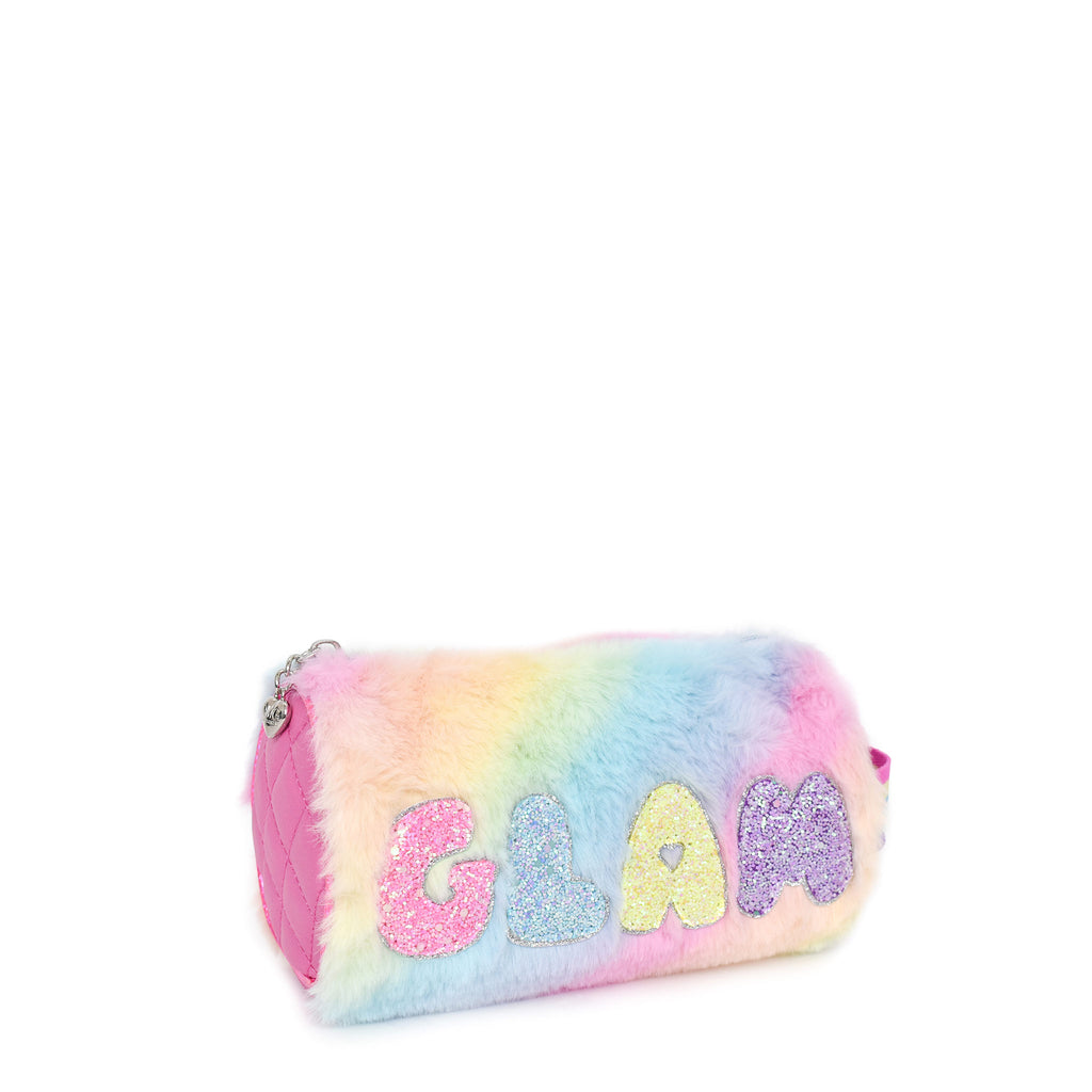 Side view of tie dye plush cylinder pouch with glitter bubble letters 'GLAM' appliqué.