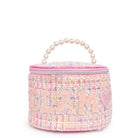 front view of a pink tweed rounded glam bag with a pearl top handle and varsity lettering 'glam' appliqué 