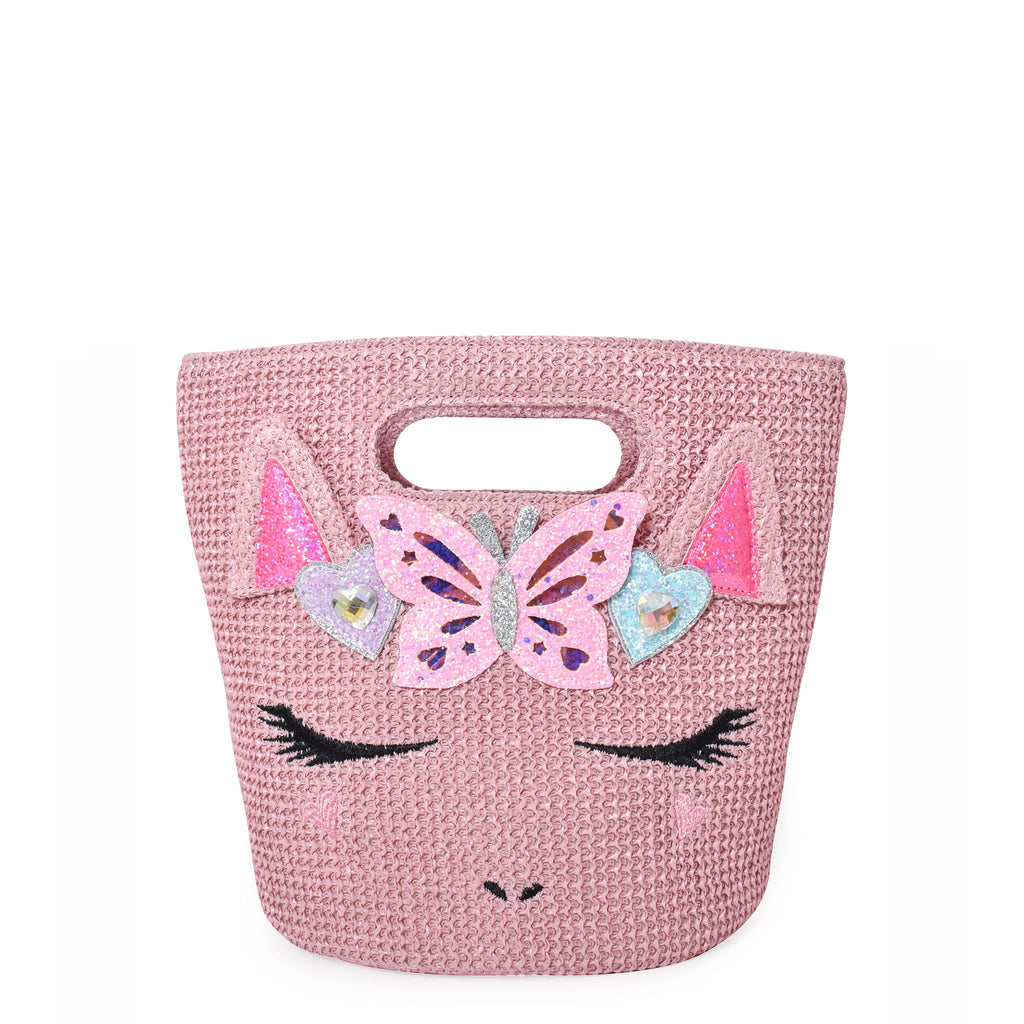 Front view of pink straw beach tote with unicorn face embellished with glitter butterfly and heart appliqués. 