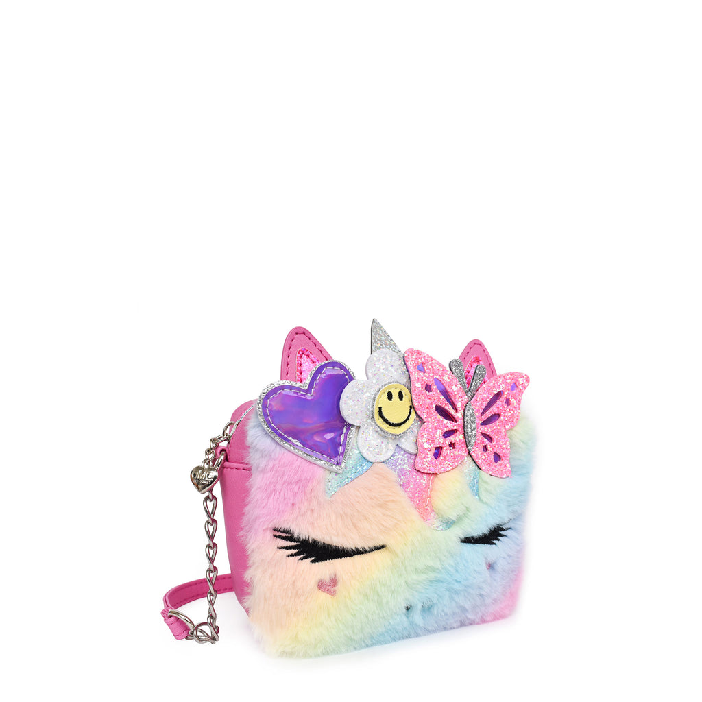 Side view of an ombre plush unicorn face crossbody with glitter daisy, butterfly, and metallic heart appliqués