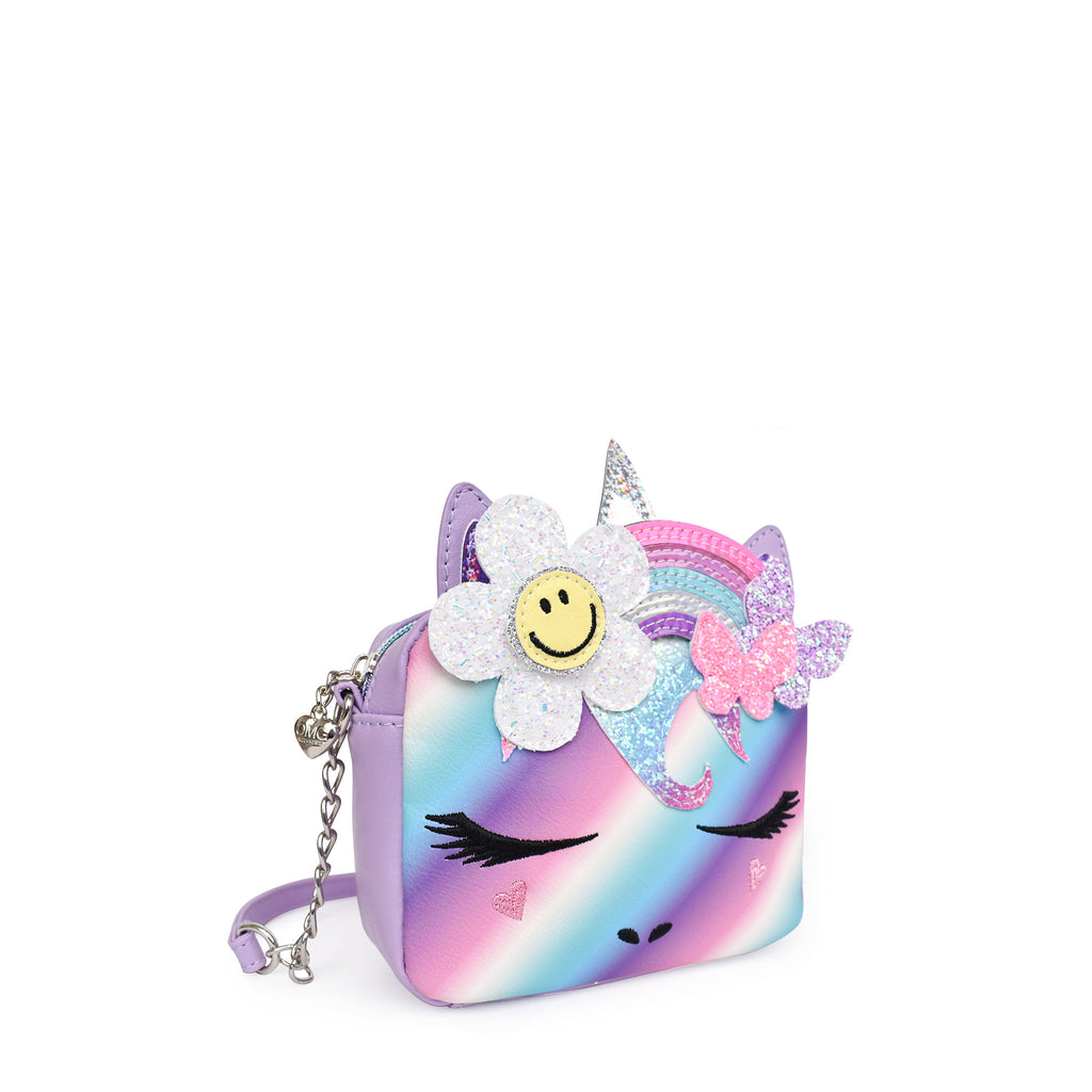 Side view of an ombre striped unicorn crossbody with a rainbow, daisy, and butterfly crown