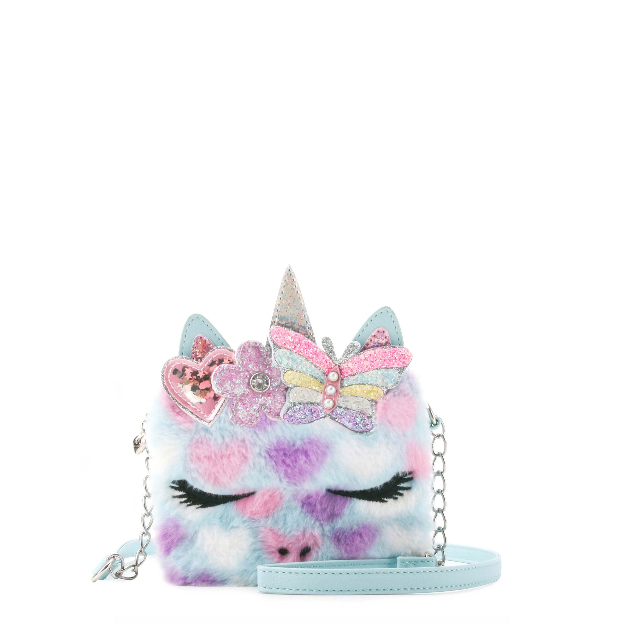 front view of a plush heart printed unicorn face crossbody bag with a glitter butterfly crown