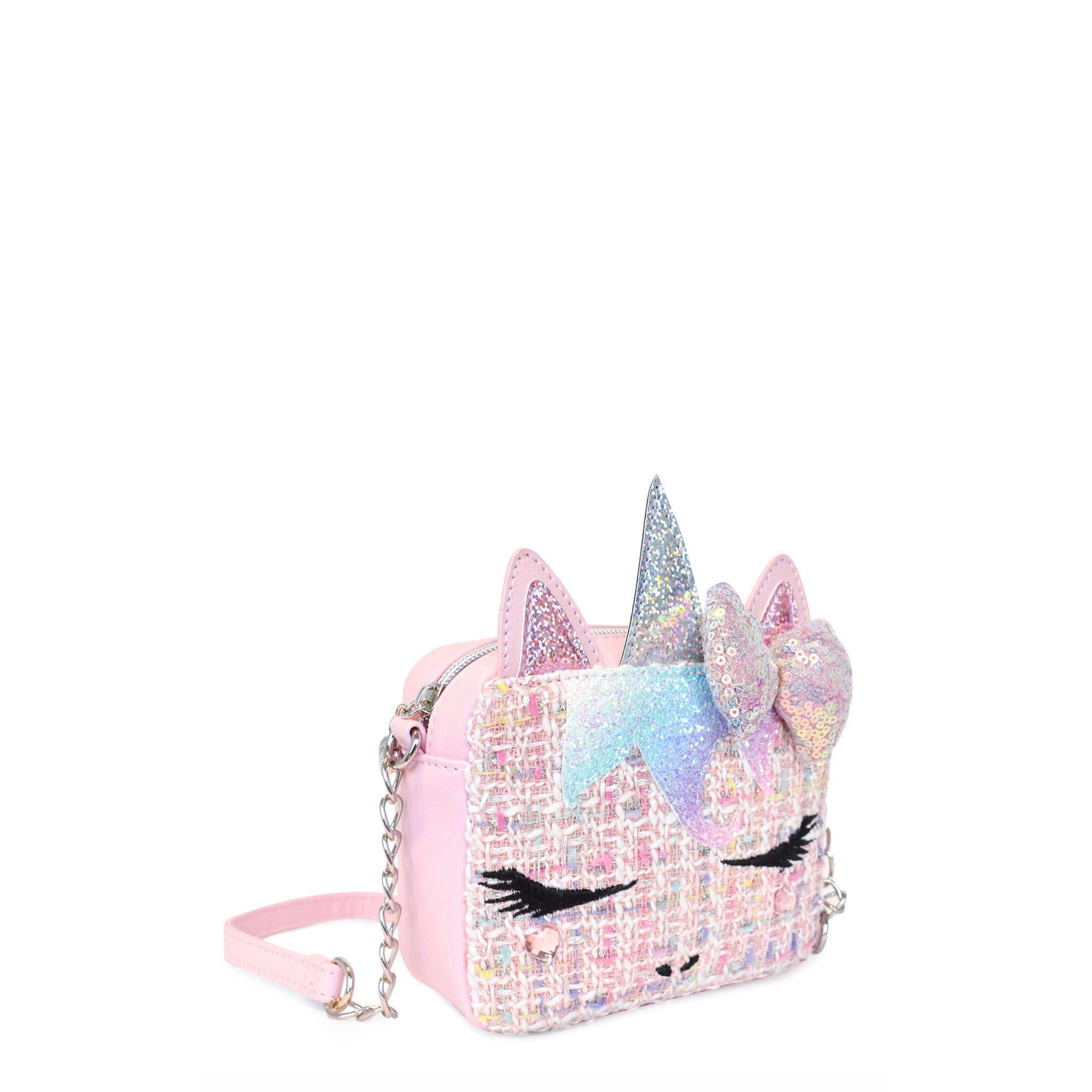 Side view of a tween unicorn face crossbody bag with a sequin puff bow