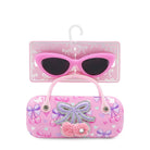 Pink sunglasses with decorative case on a white background