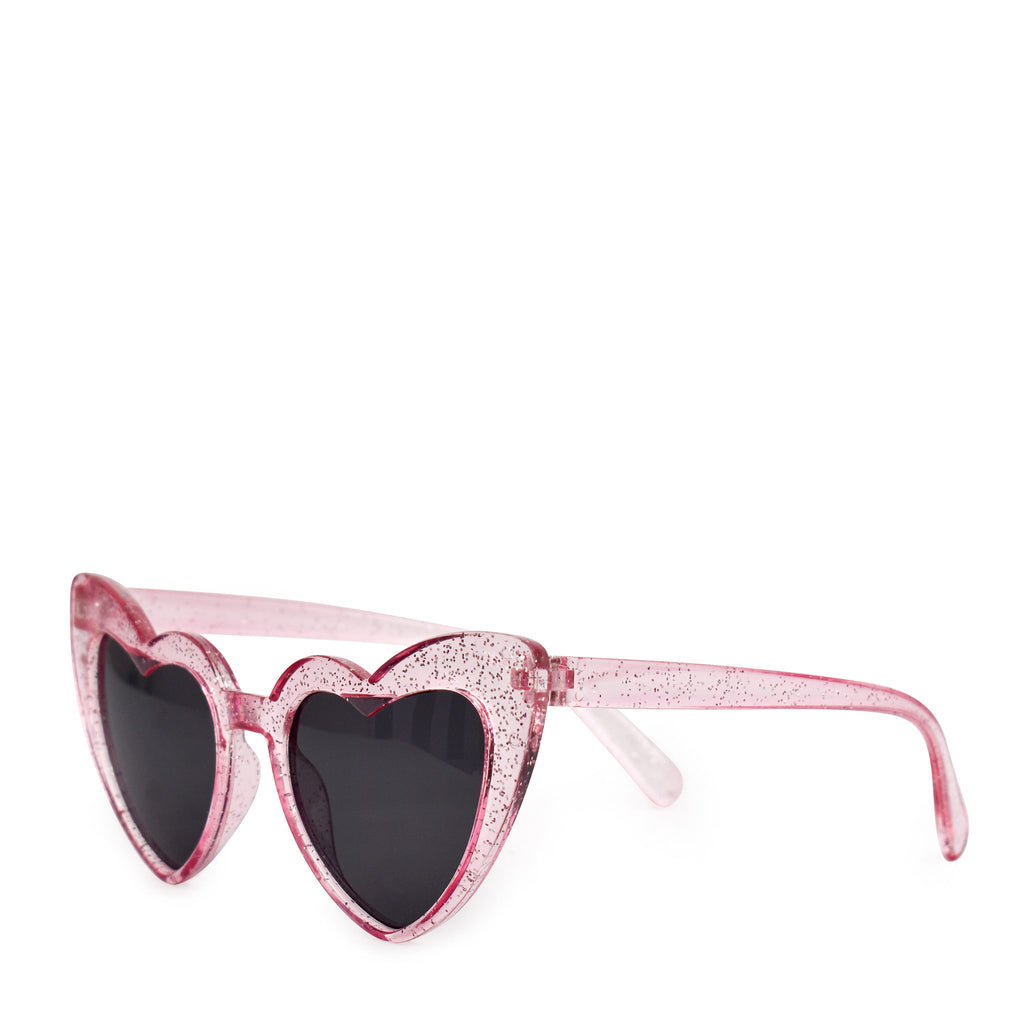 Side view of pink glitter heart shaped sunglasses