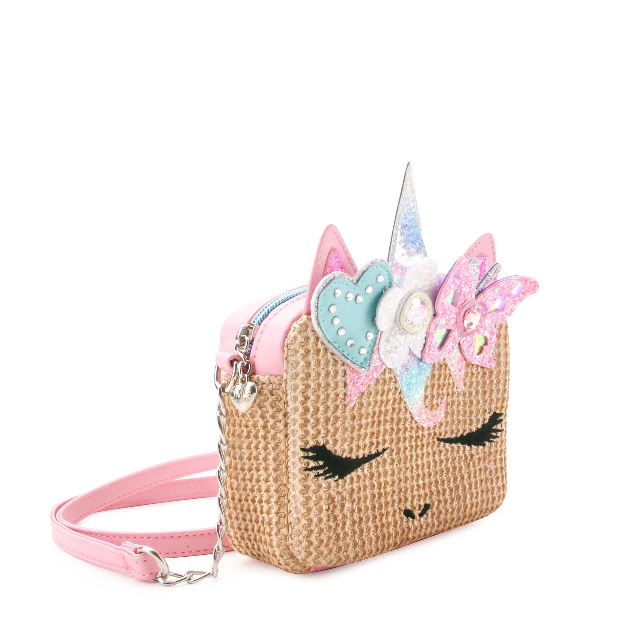 side view of a straw unicorn face crossbody with a glitter butterfly and flower crown