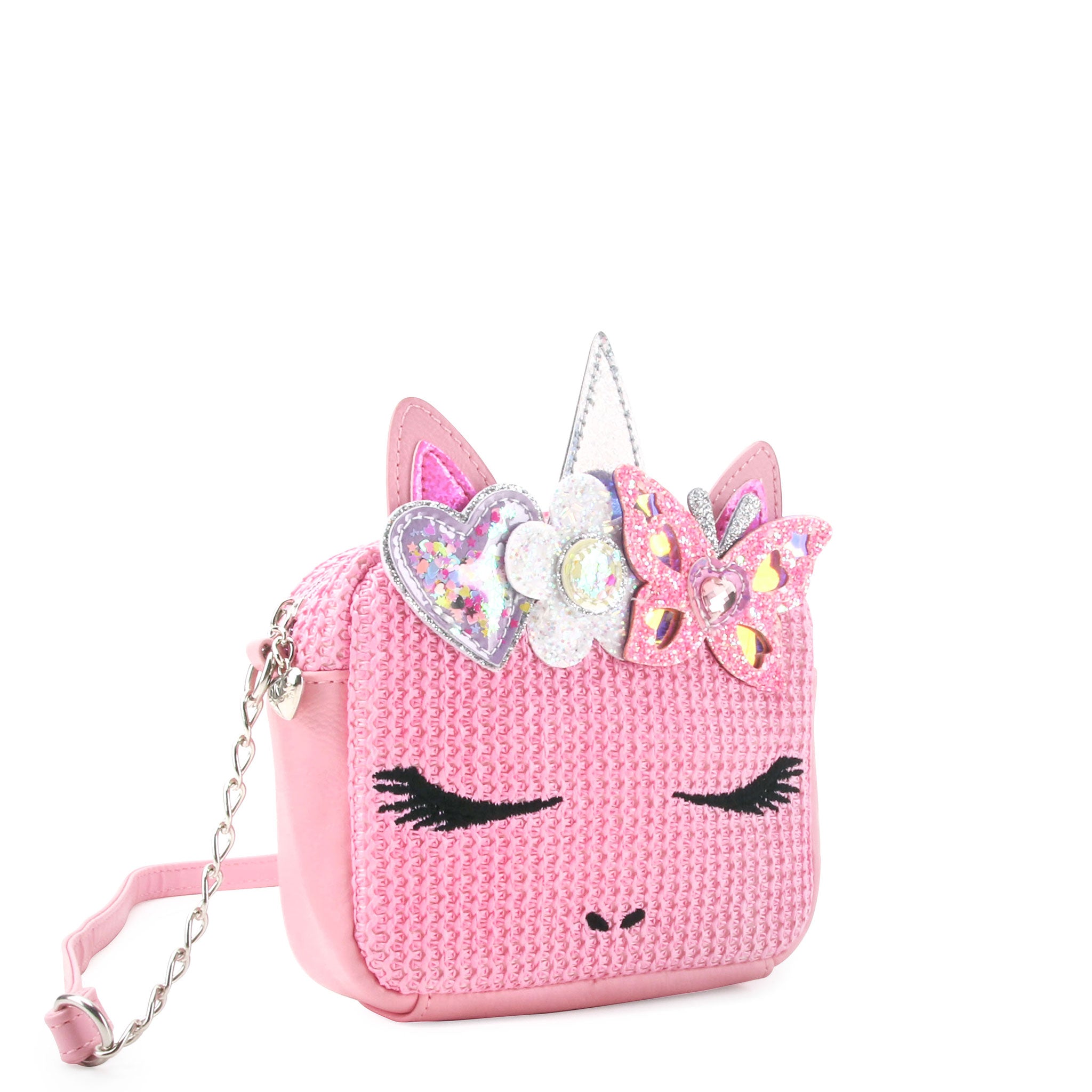 side view of a pink straw unicorn crossbody bag with a glitter butterfly & flower crown 