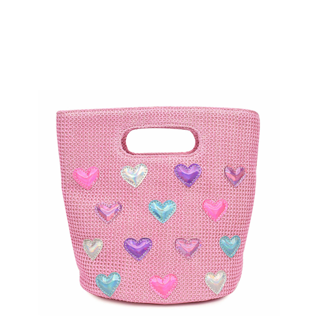 Front view of pink straw tote bag covered with metallic multi colored heart appliqués.