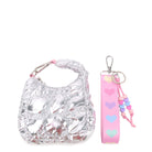 front view of a quilted silver metallic crescent shaped keychain and a pink lanyard keychain with pastel hearts and beaded detailing.
