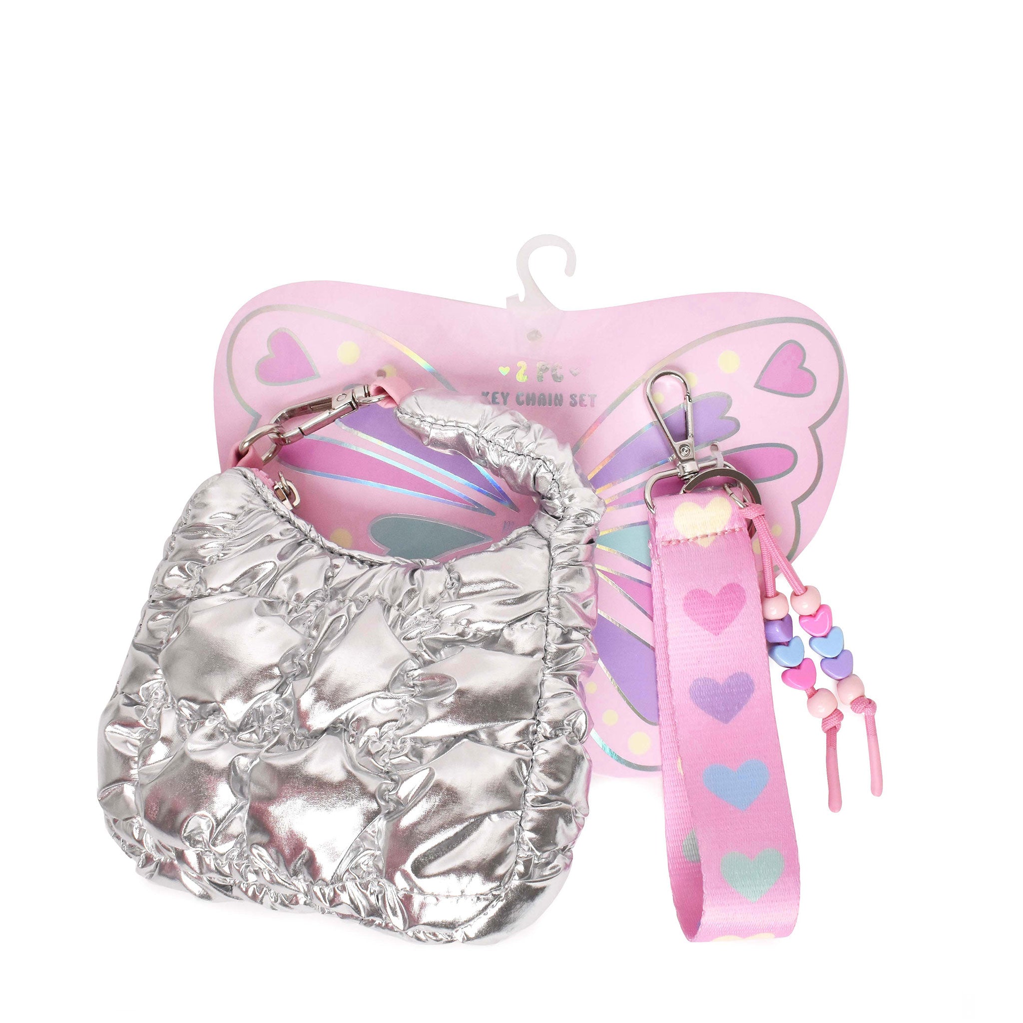 front view of a quilted silver metallic crescent shaped keychain and a pink lanyard keychain with pastel hearts and beaded detailing attached to pink butterfly shaped cardboard