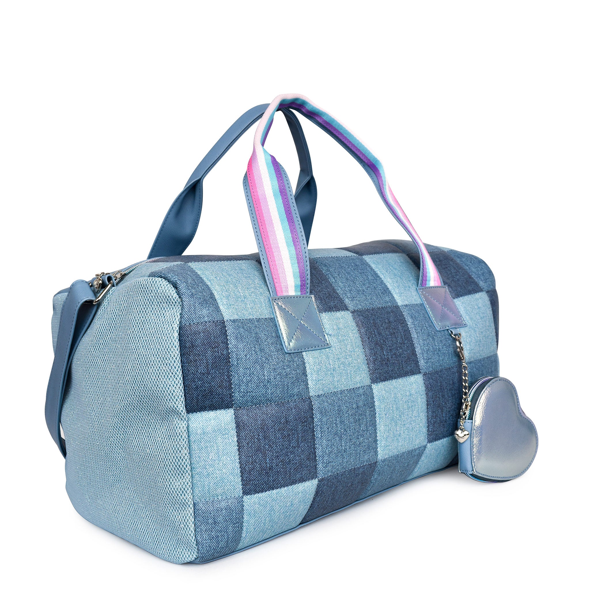 Side view of a denim patchwork checkerboard large duffle bag with a metallic heart shaped coin purse keychain