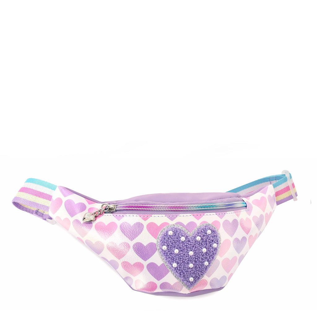 Side view of a metallic pink and purple heart printed fanny pack with a chenille and pearl heart appliqué