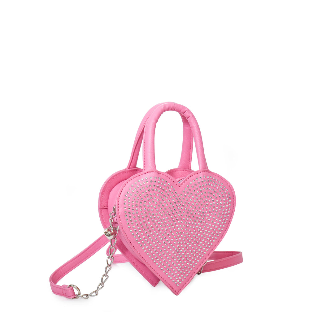 Side  view of pink heart-shaped top handle crossbody bag embellished in rhinestones