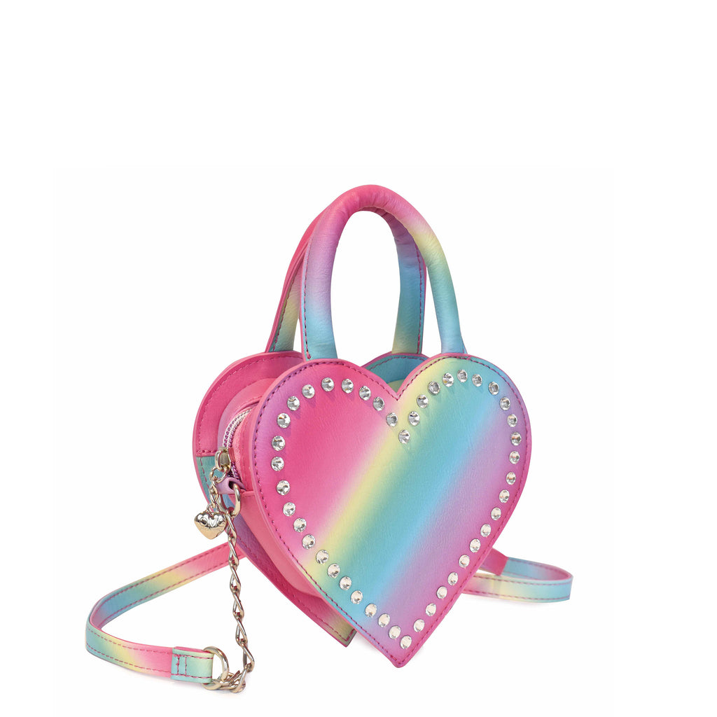 Side view of a rainbow ombre heart shaped top handle crossbody with rhinestones