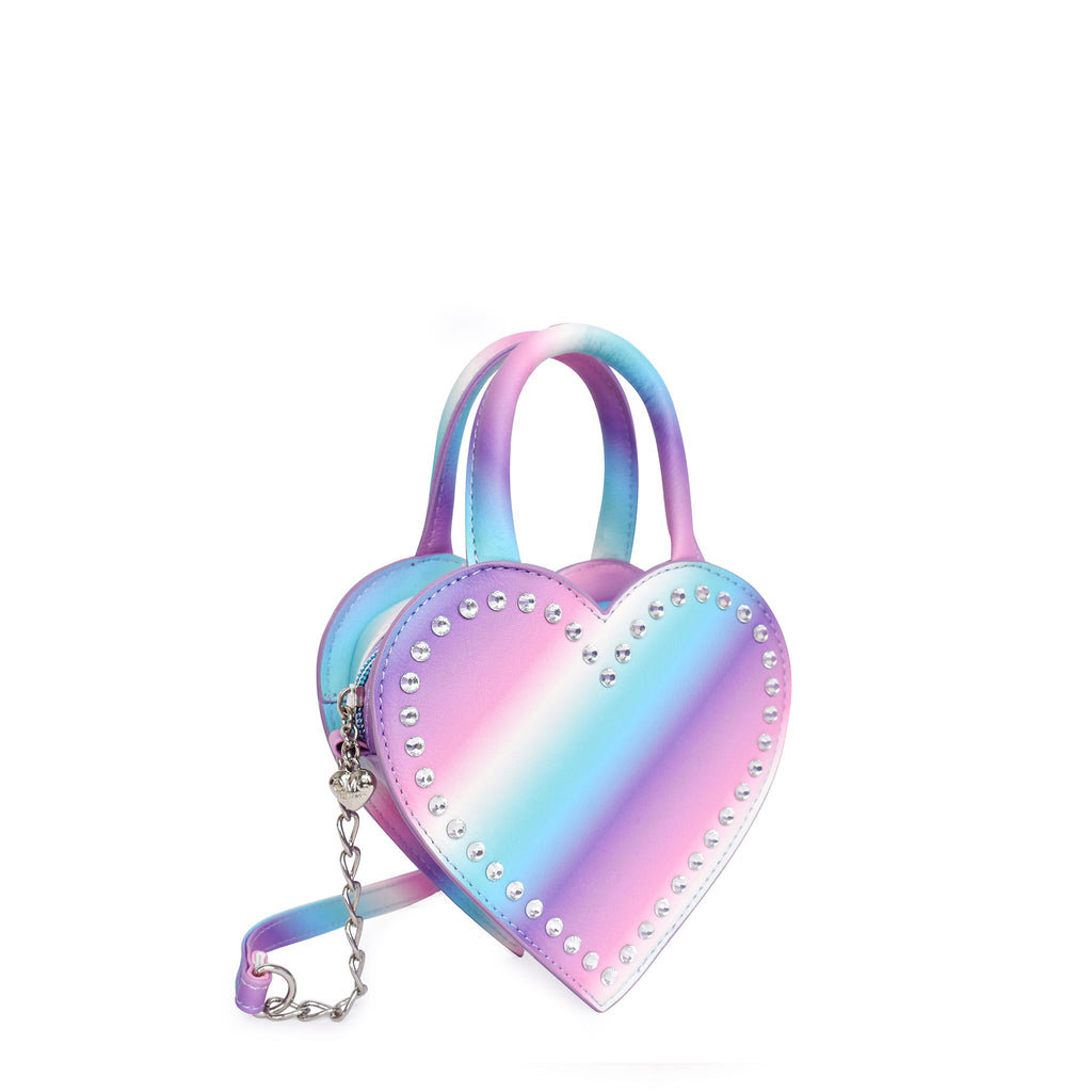 Side view of an ombre heart shaped top handle crossbody outlined with rhinestones