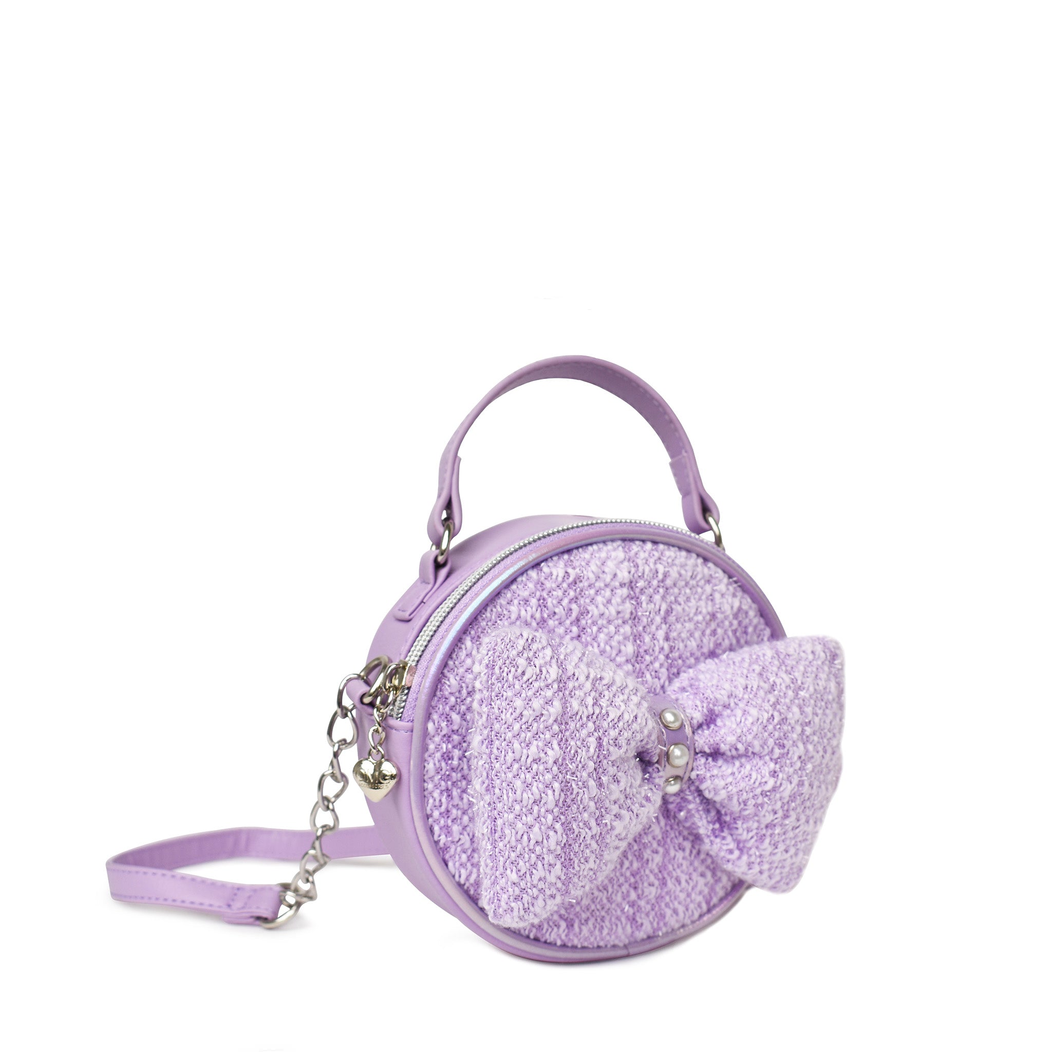 side view of a purple tweed rounded crossbody bag with with a large bow applique