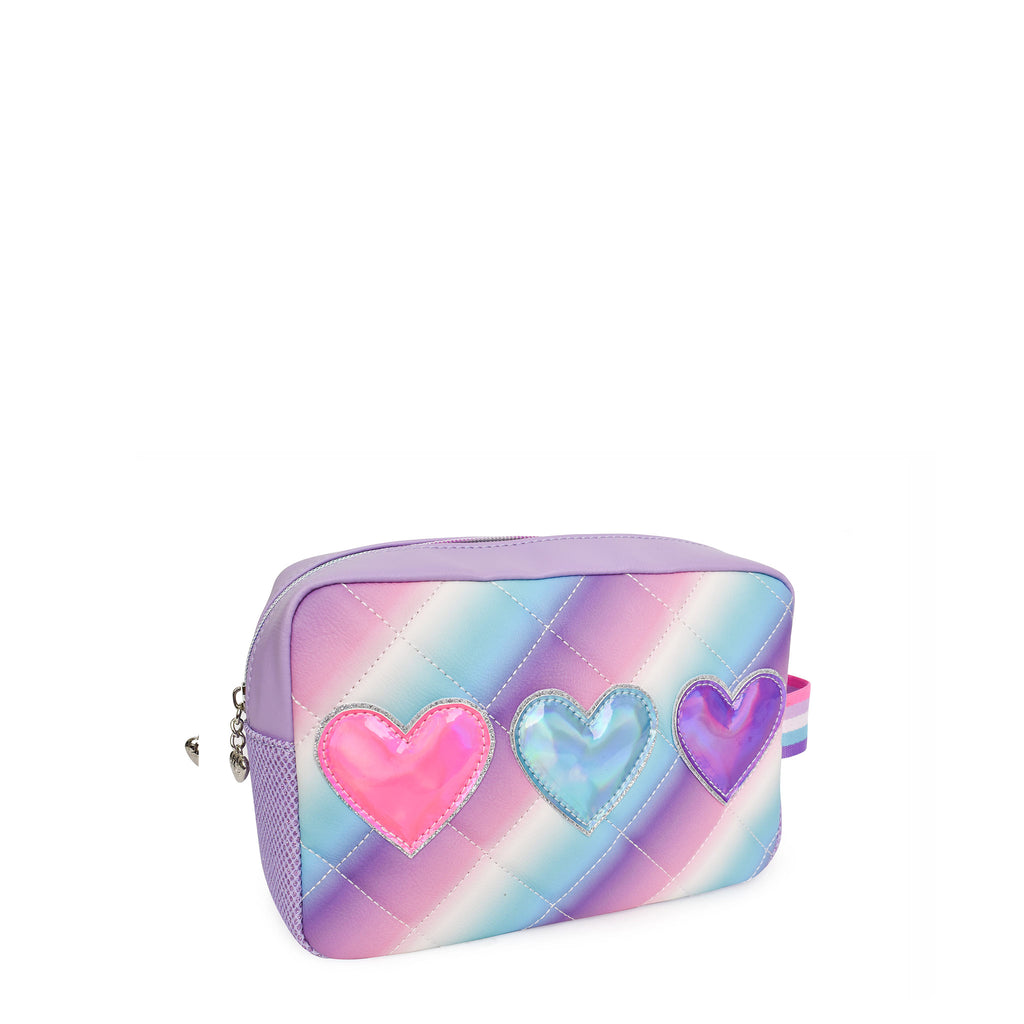 Side view of a blue, white and purple ombre quilted pouch with three metallic heart patches