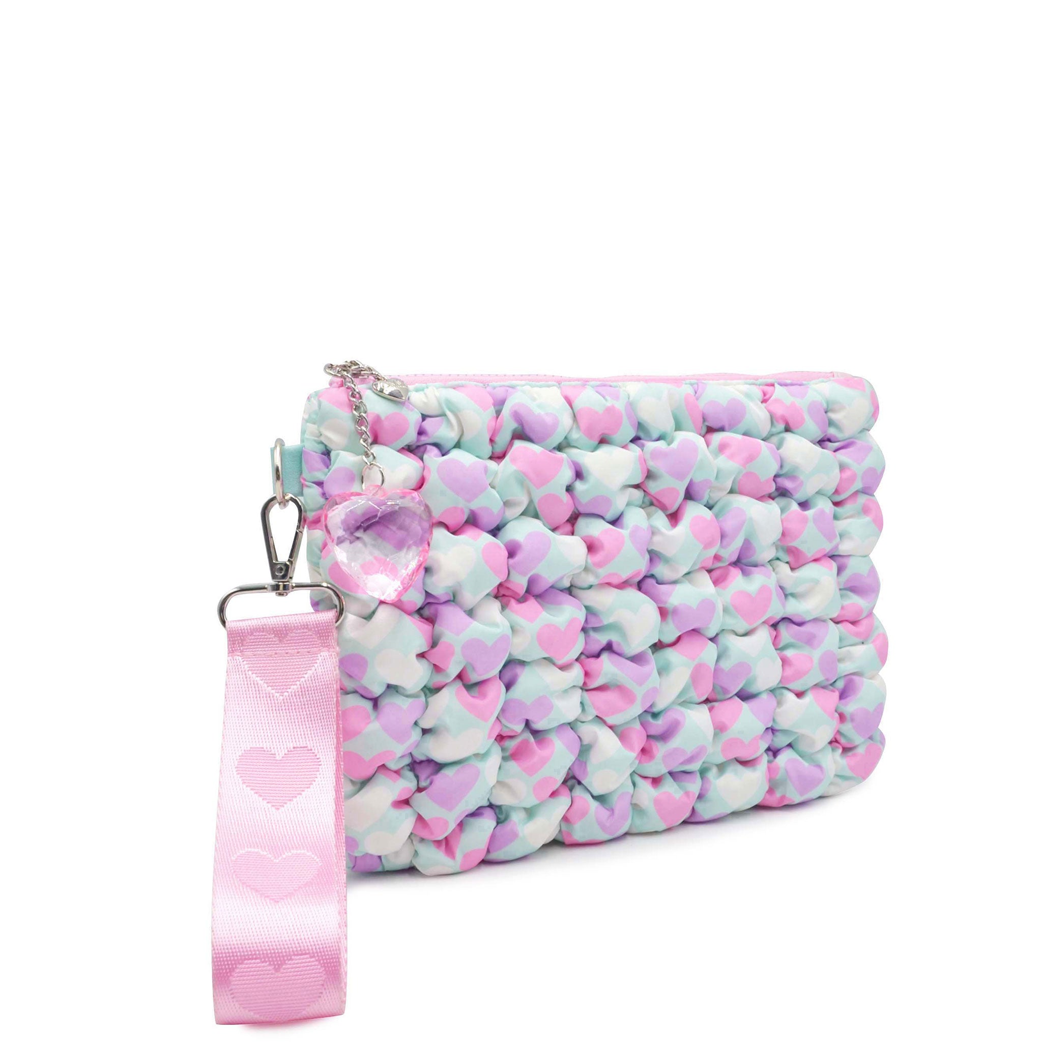 side view of a heart printed aqua nylon quilted zipper pouch with detachable wristlet