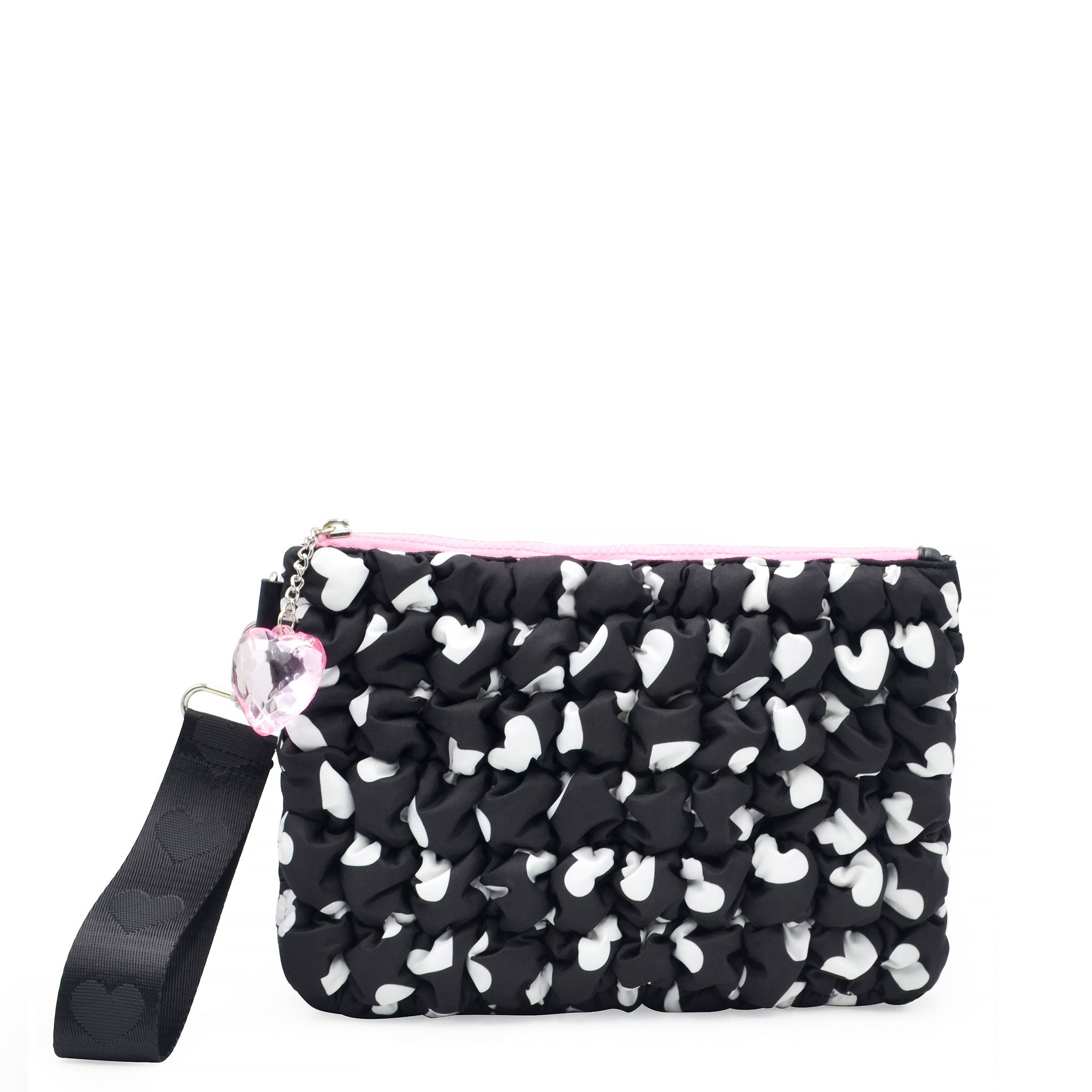 front view of a black and white heart printed quilted wristlet pouch with a wrist strap