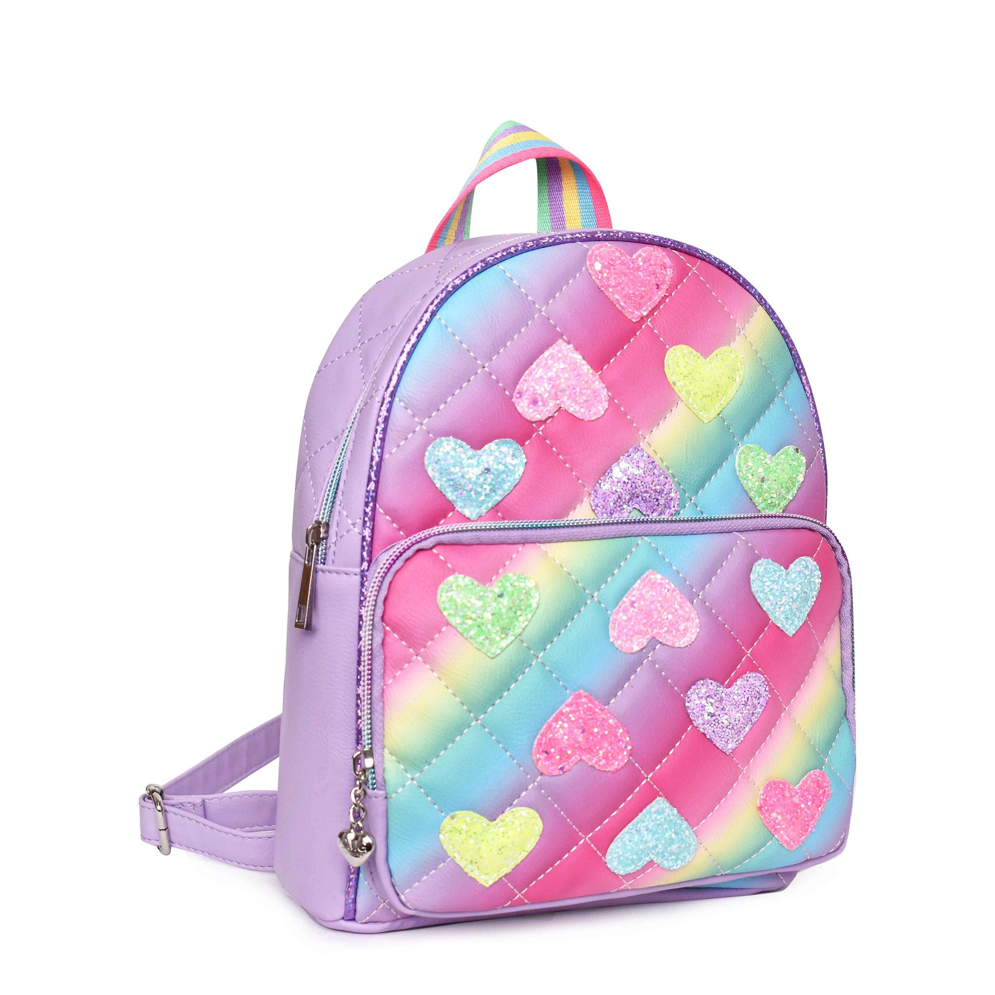 Side view of an ombre quilted mini backpack with glitter heart patches