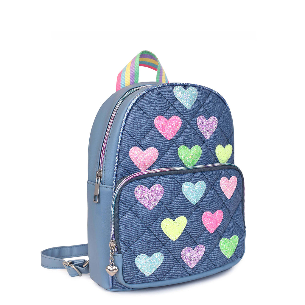 Side  view of a quilted denim mini backpack with glitter heart patches