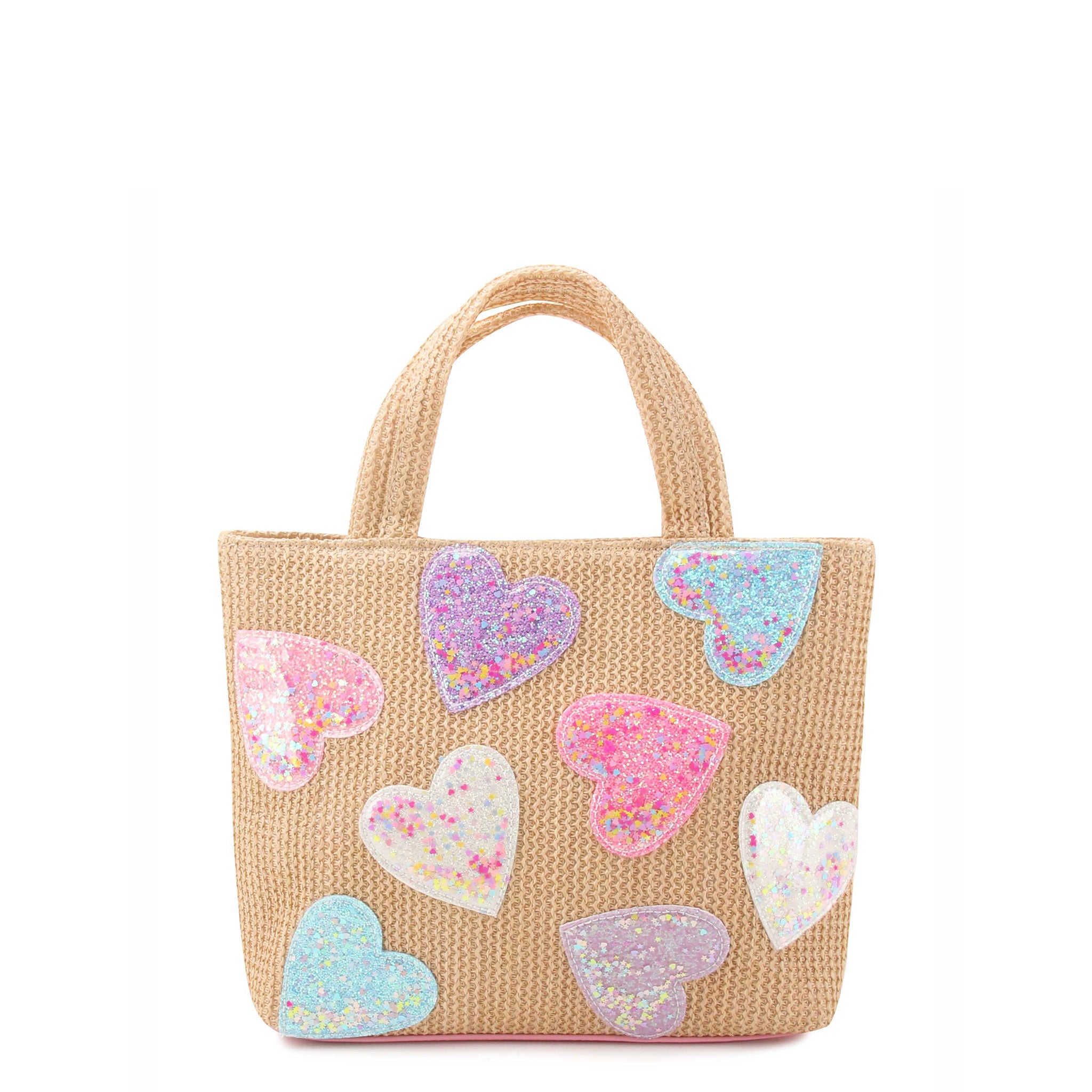 front view of a straw mini tote covered in confetti filled heart patches