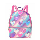 Front view of a cool toned pastel ombre mini backpack with metallic heart patches 