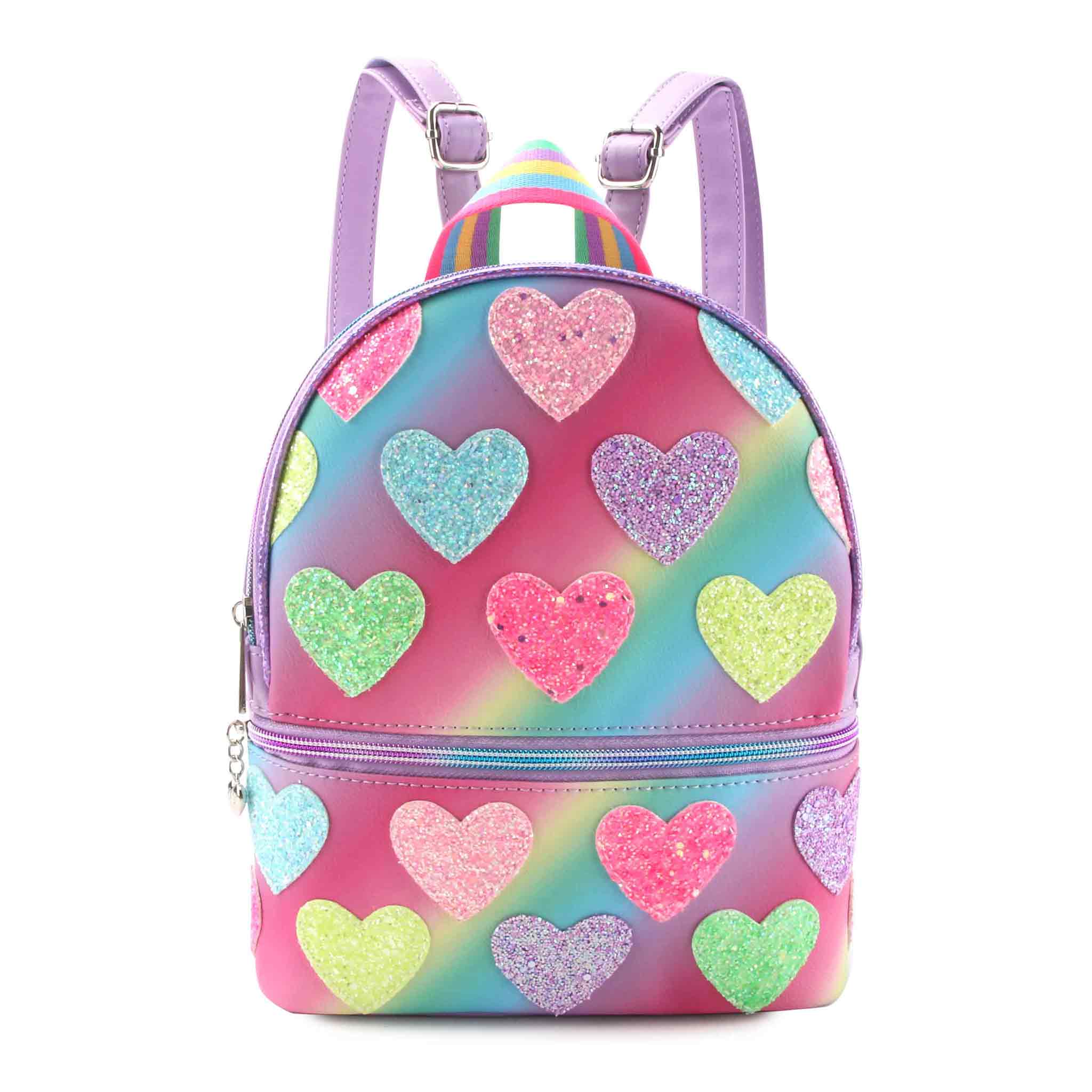 Front view of a ombre rainbow mini backpack with glitter rainbow heart patches