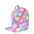 side view of a ombre rainbow mini backpack with glitter rainbow heart patches
