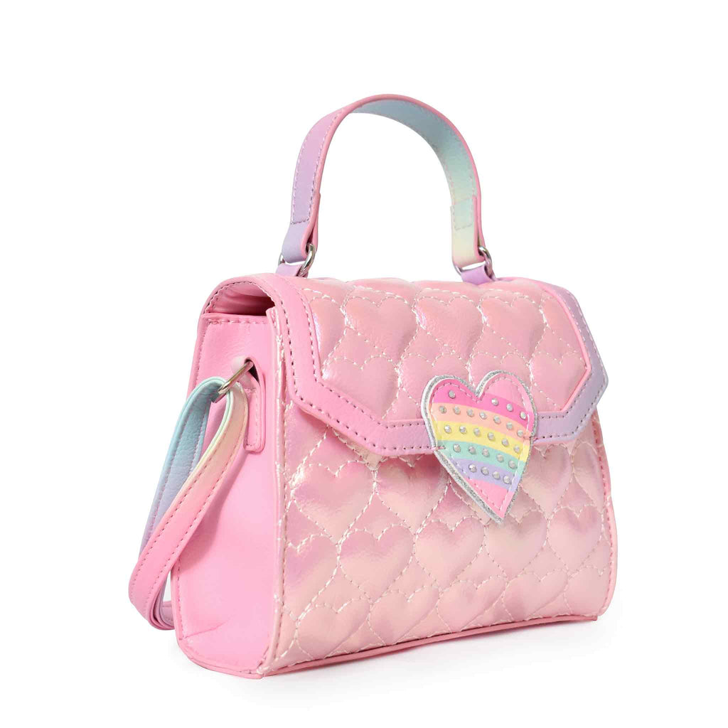 Side view of heart quilted metallic mini top-handle bag