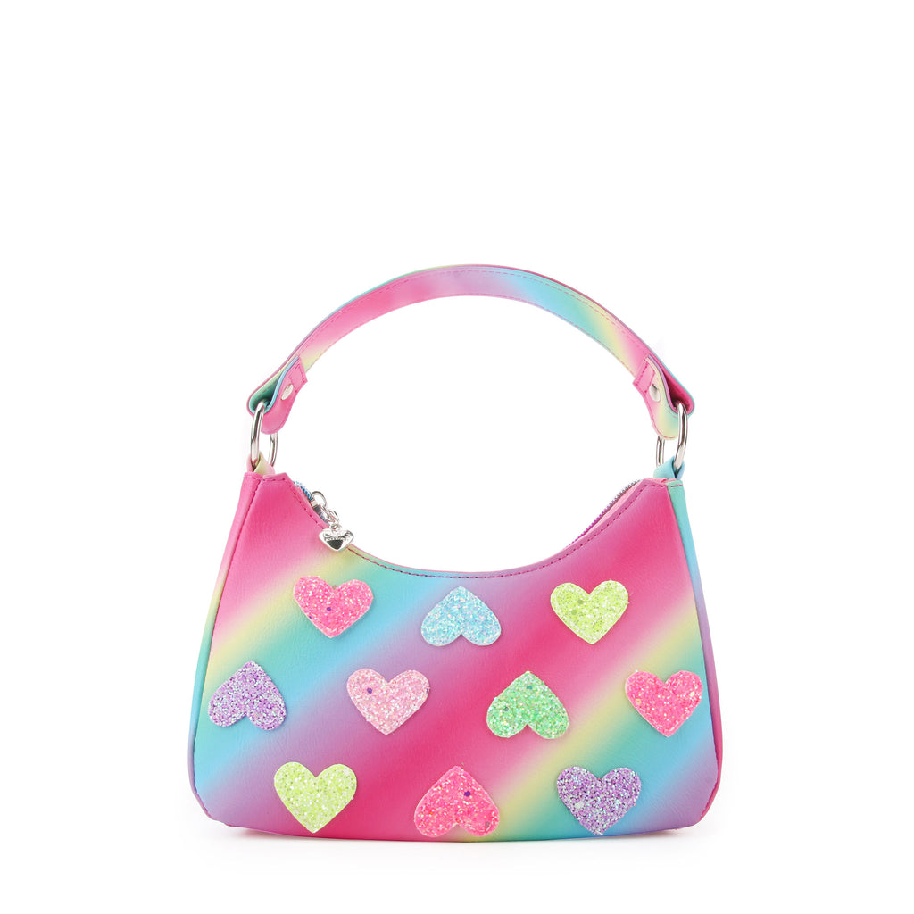 Front view of a rainbow ombre striped mini hobo bag with glitter heart patches