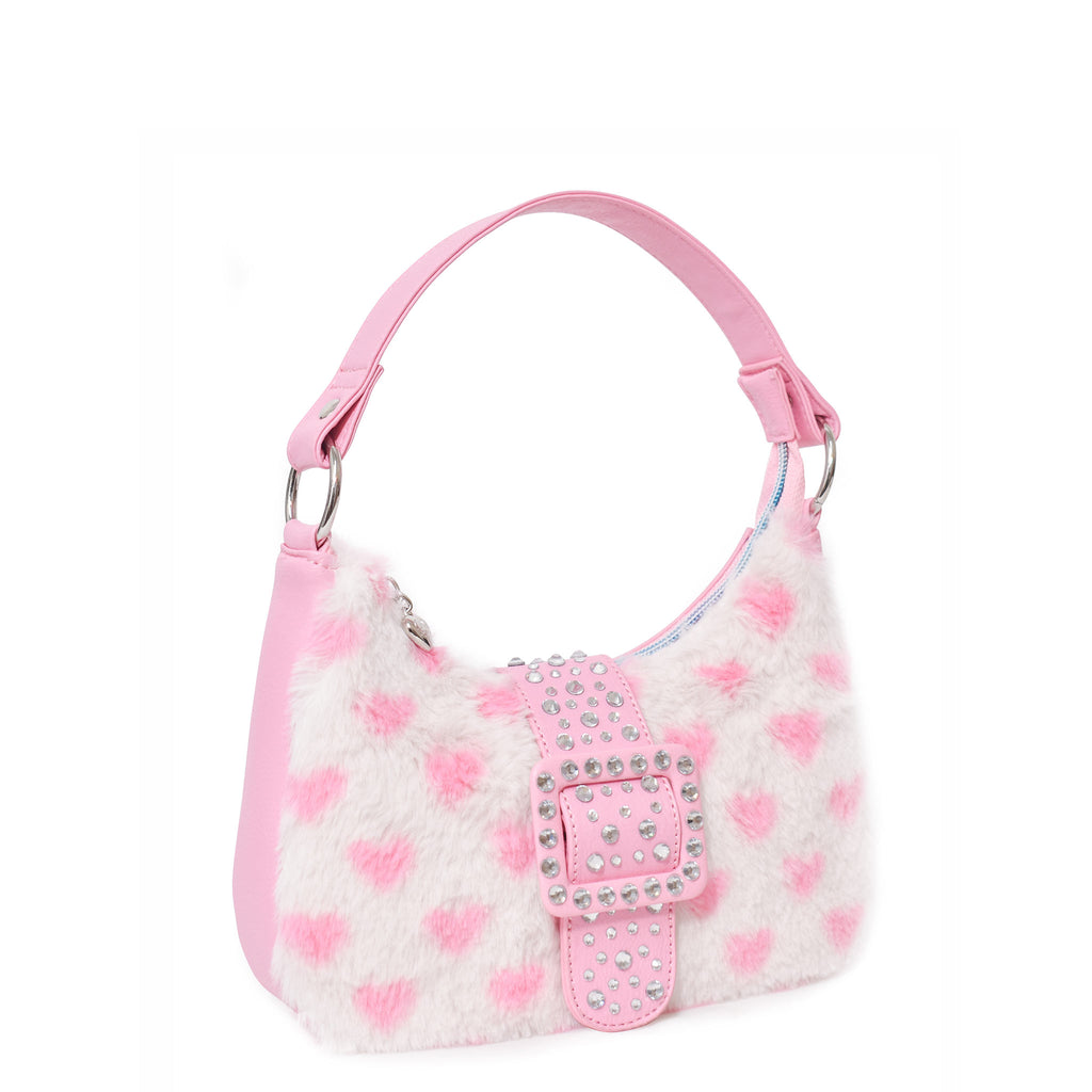Side view of white plush mini pink heart-printed crescent bag with pink rhinestone buckle