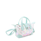 side  view of a confetti filled pouchette style crossbody bag with aqua top handles & strap closure 