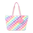 Front view of an ombre heart printed large tote bag with a plush heart detachable charm 