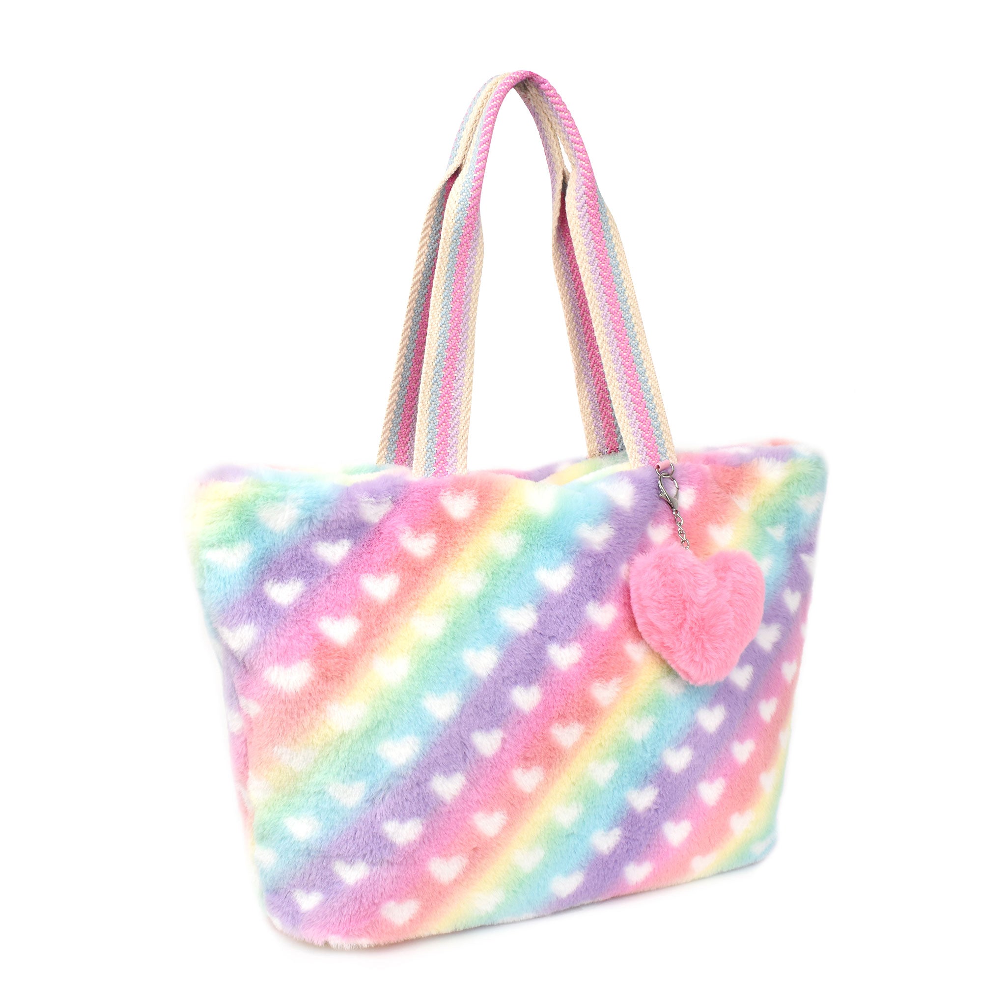 side view of an ombre heart printed large tote bag with a plush heart detachable charm 
