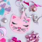 photoshoot photo of pink silicone kitty cat luggage tag set of 2