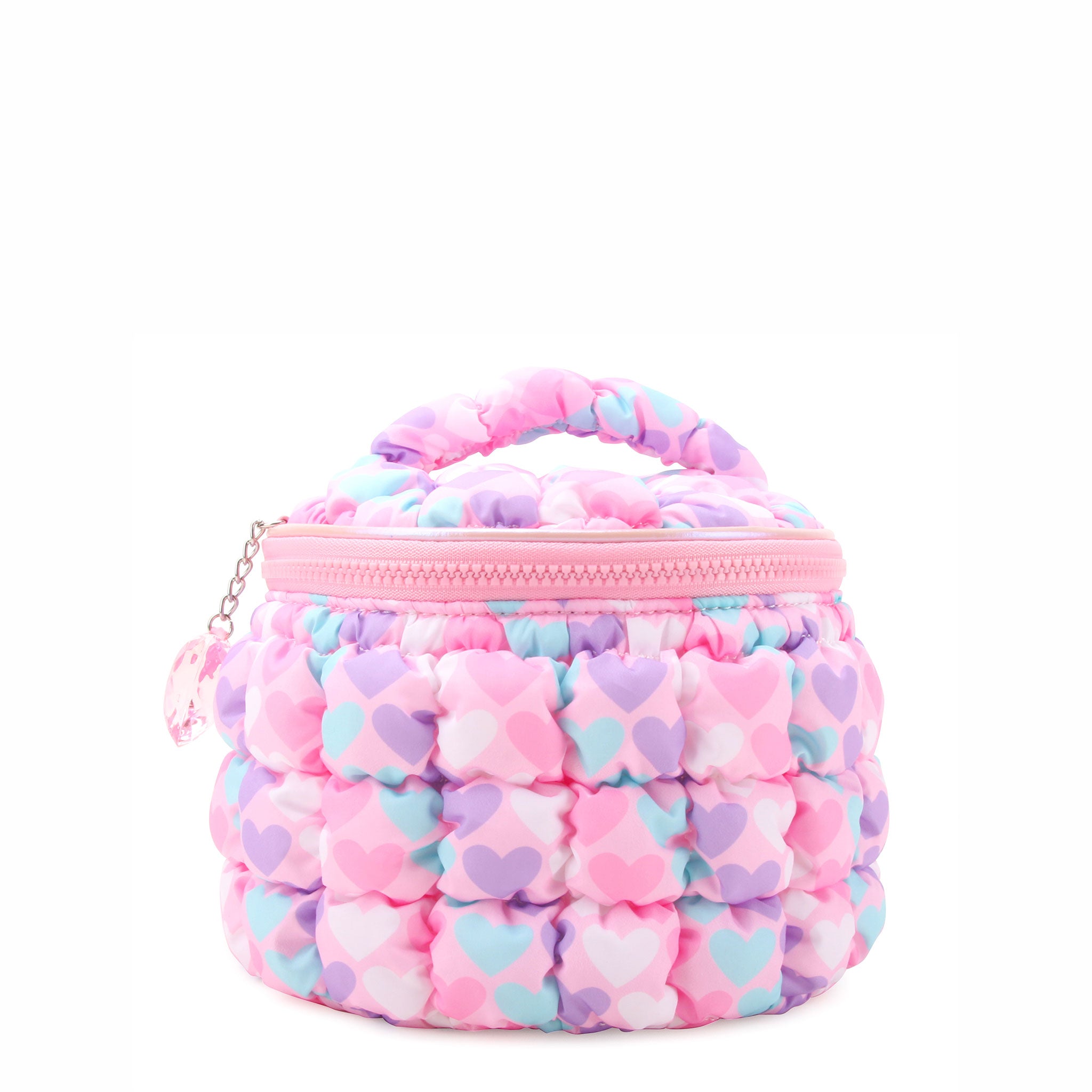 front view of a pink, heart-printed nylon quilted, round train case with a heart gem charm.