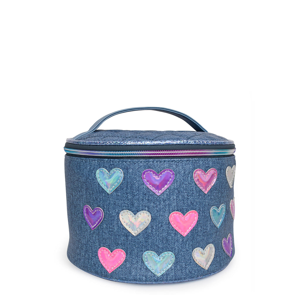 Side view of a denim round train case covered in metallic heart patches