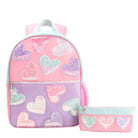 front facing view of a pink, purple, and mint green color blocked backpack with a front zipper pocket and confetti heart appliqués, and a matching pencil case