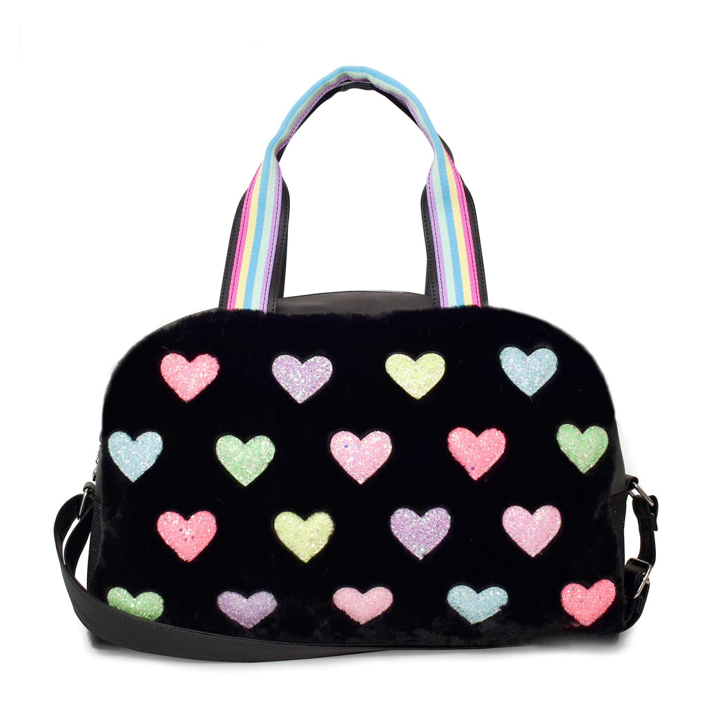 Front view of black plush medium duffle with glitter heart patches