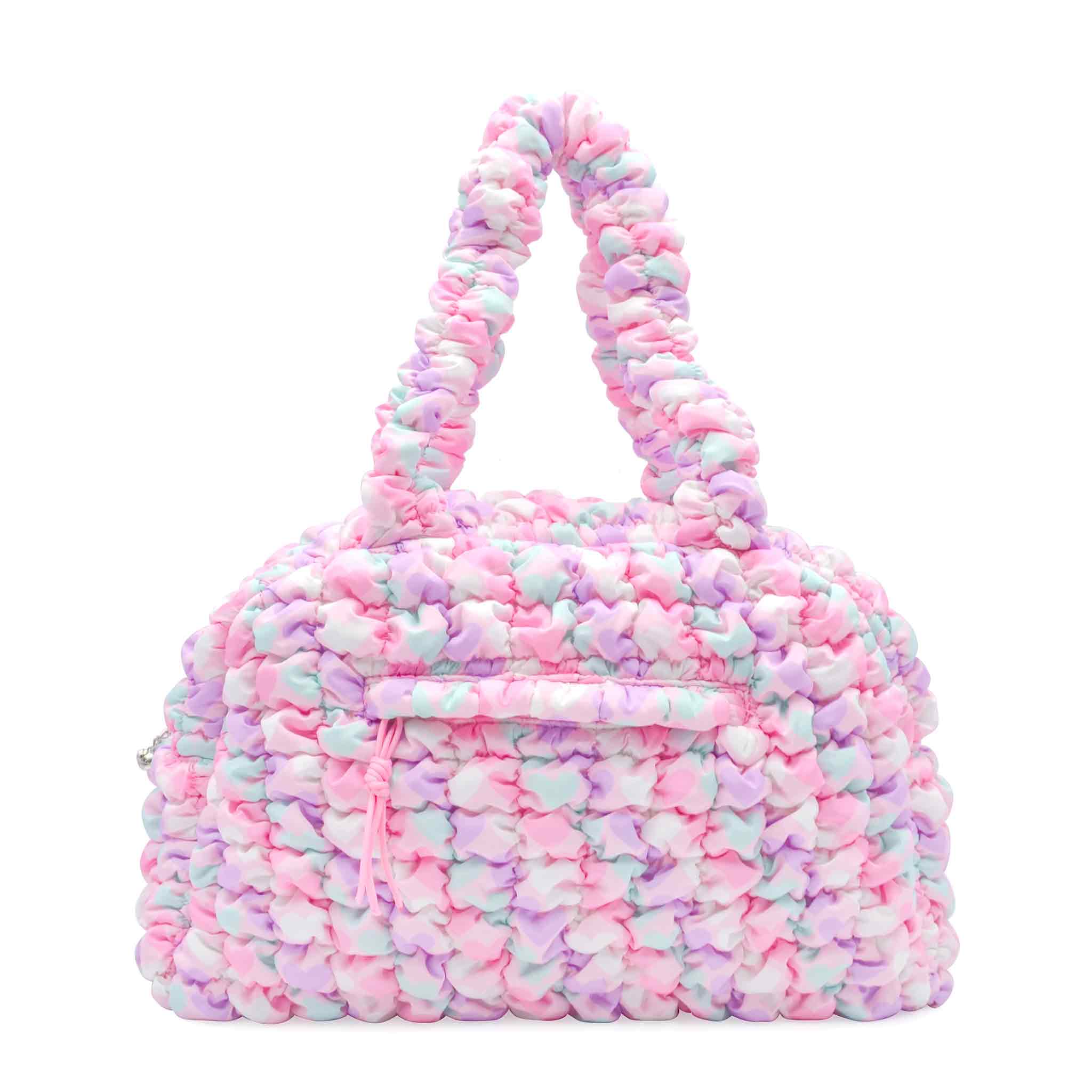 front view of a pink heart printed medium quilted nylon duffle bag 