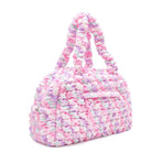 side view of a pink heart printed medium quilted nylon duffle bag 