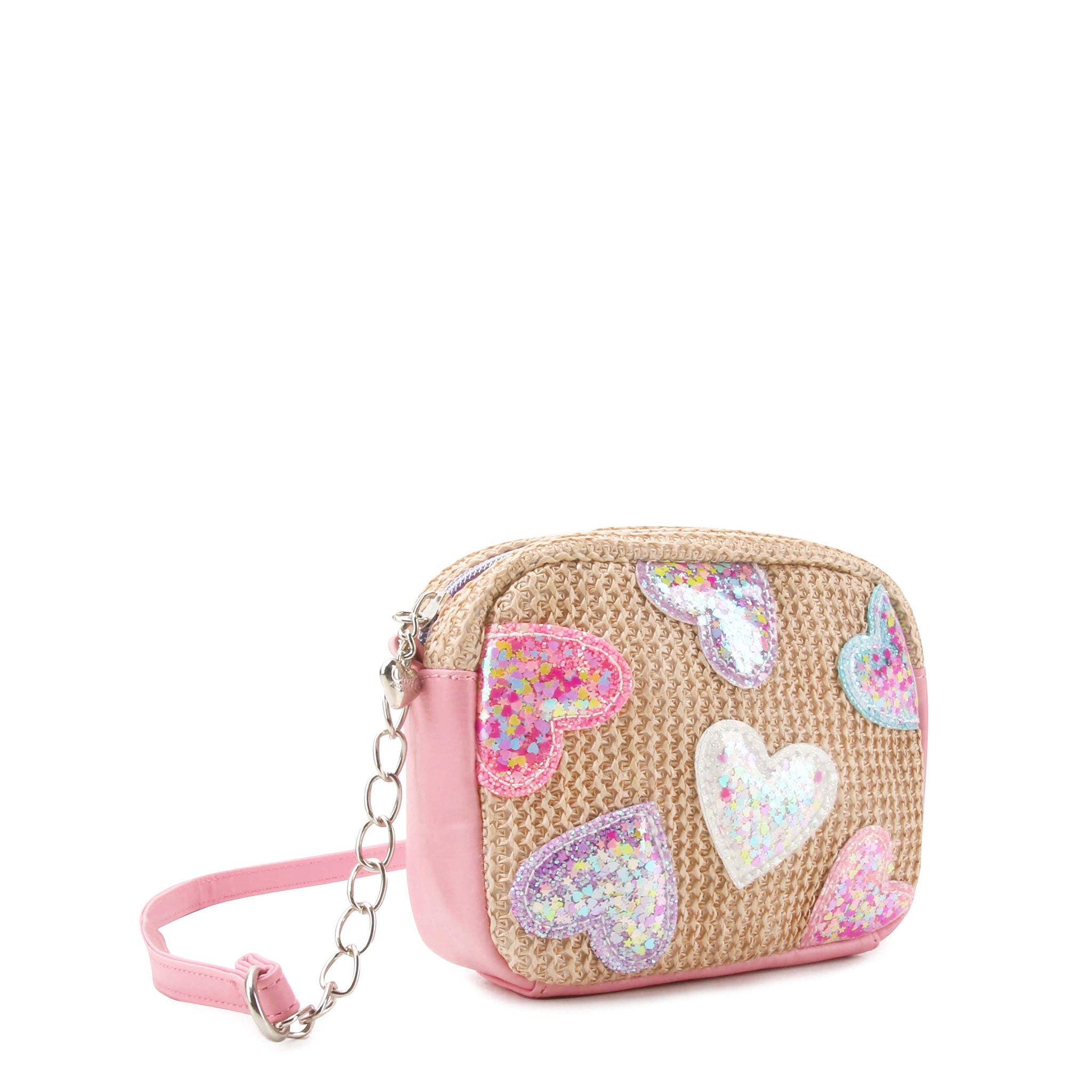 side view of a straw crossbody bag with confetti filled heart patches