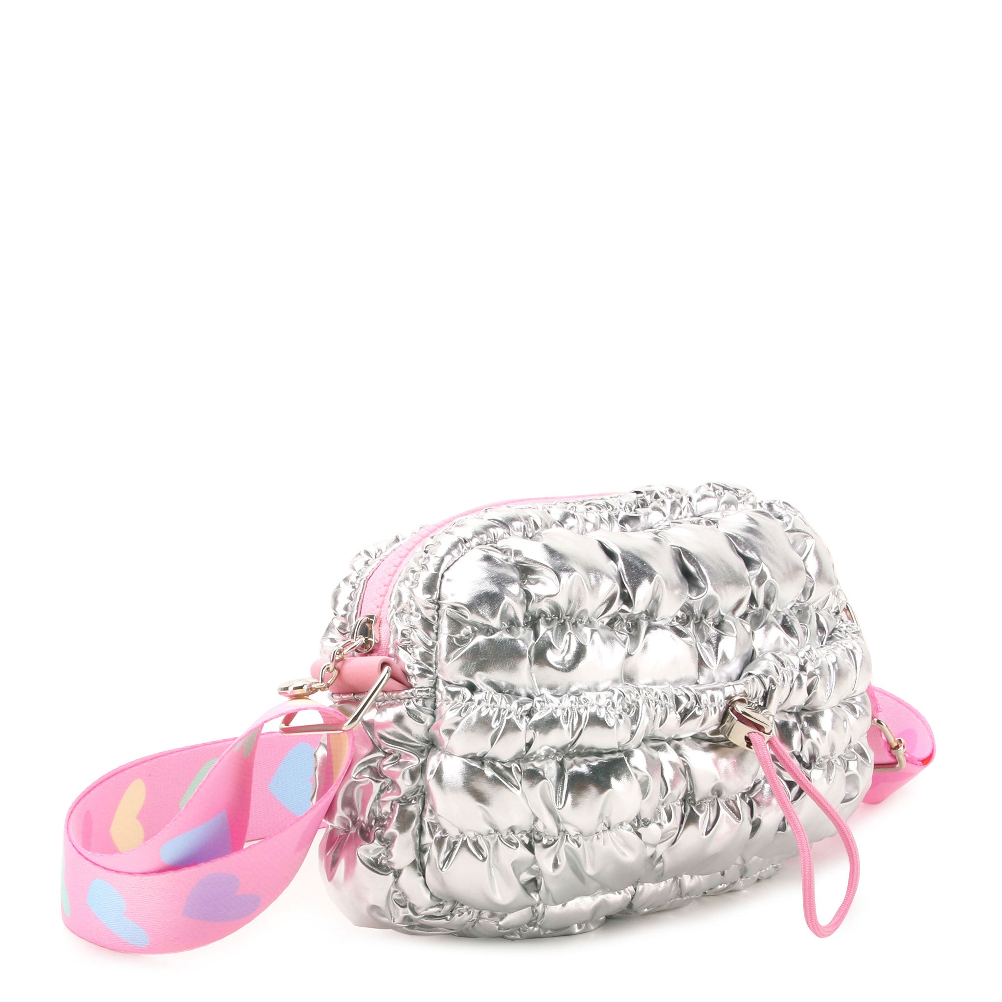 3/4 angle view of a silver metallic quilted bag with a pink crossbody strap and a drawstring closure front pocket 