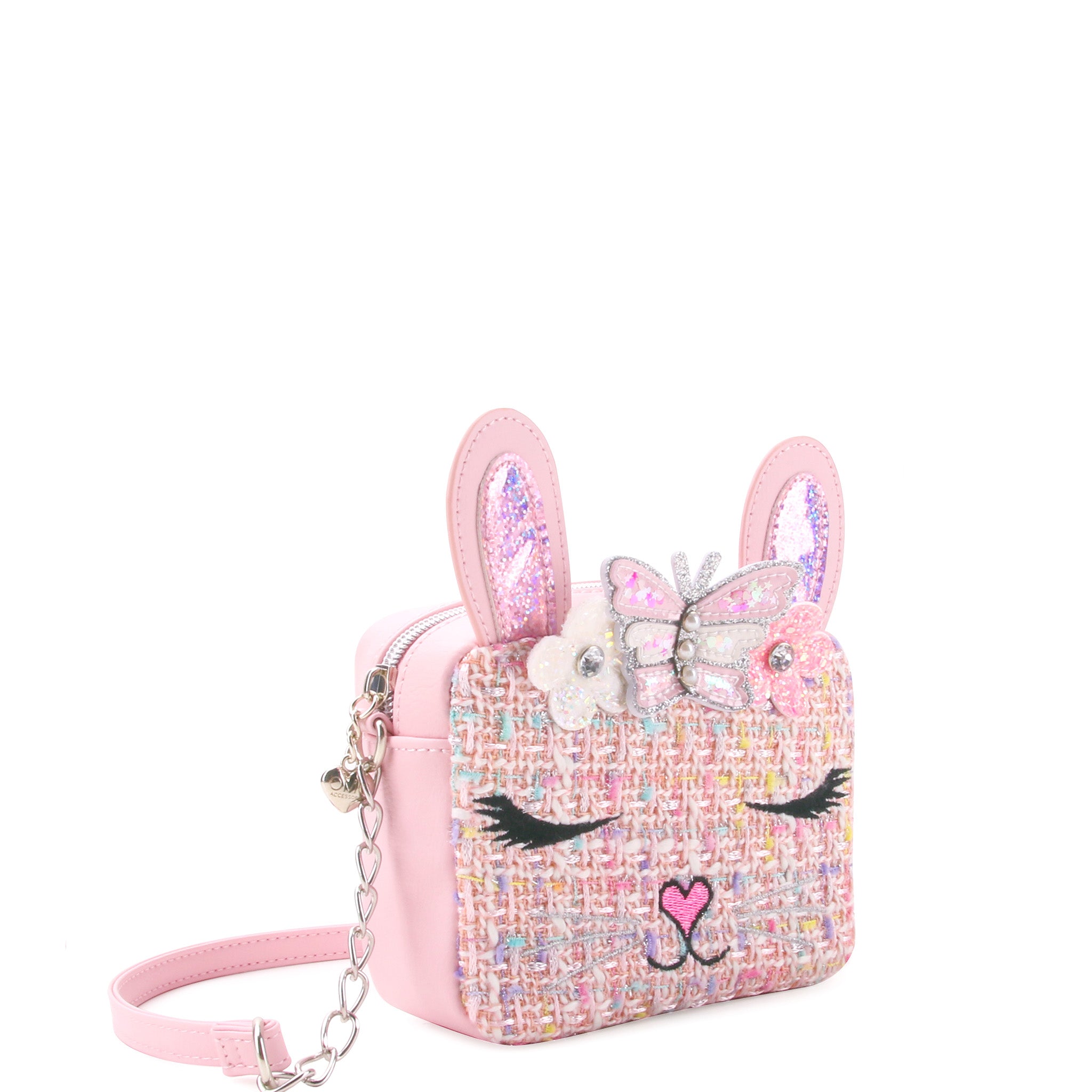 side  view of a pink tweed bunny face crossbody bag with a confetti filled butterfly crown