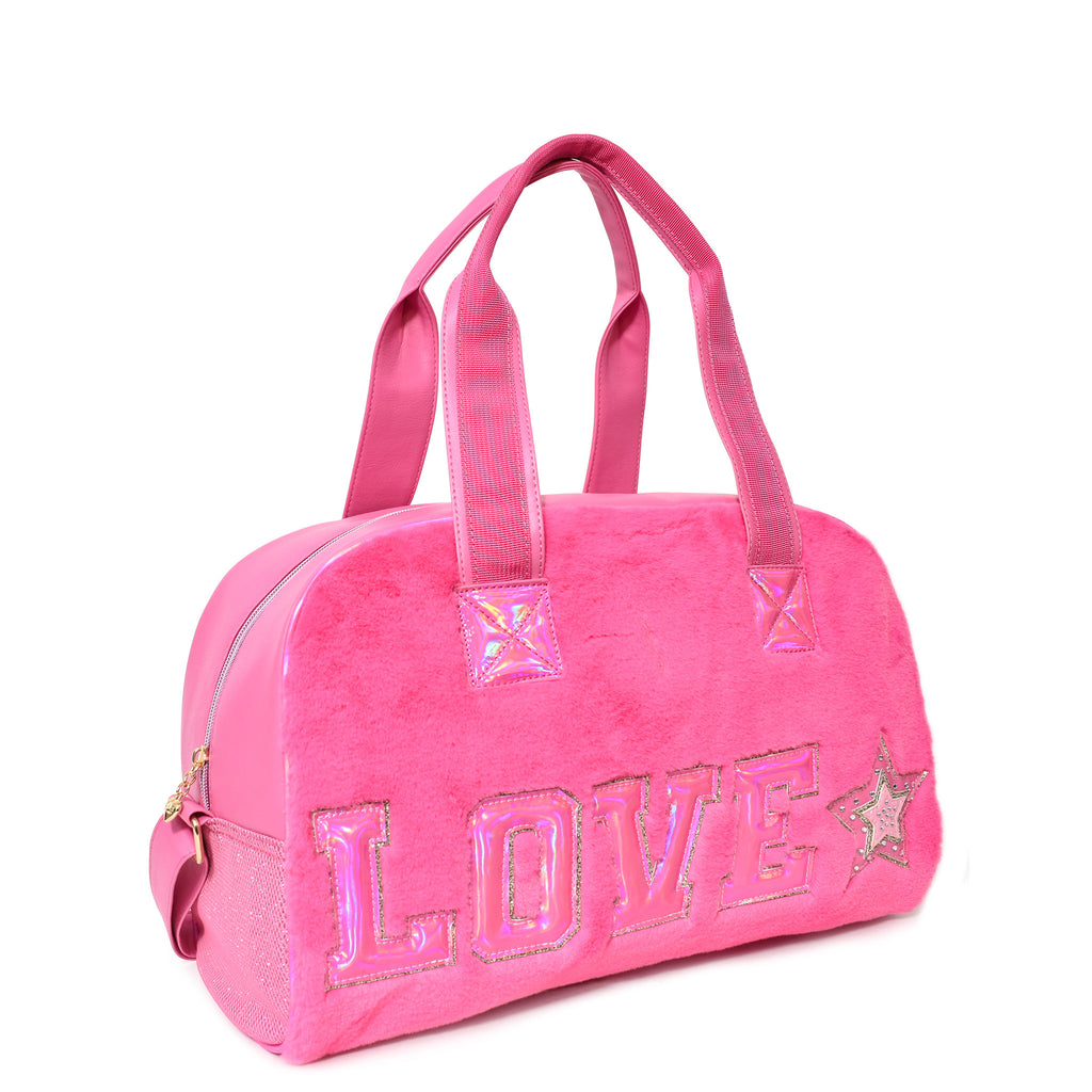 Side view of hot pink plush medium duffle with metallic varsity letters 'LOVE' and rhinestone star appliqué
