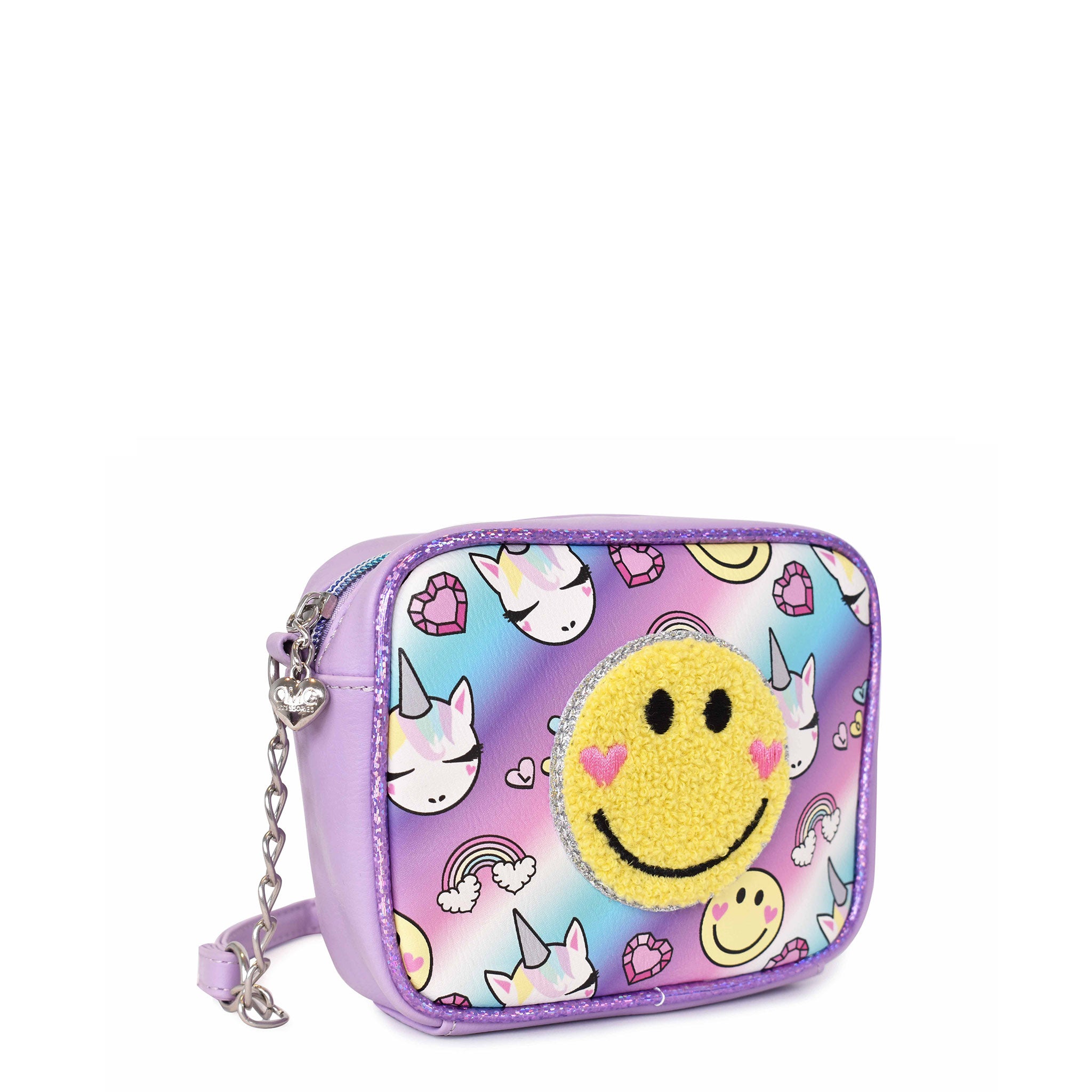 Sideview of a unicorn and rainbow printed crossbody with a chenille happy face appliqué
