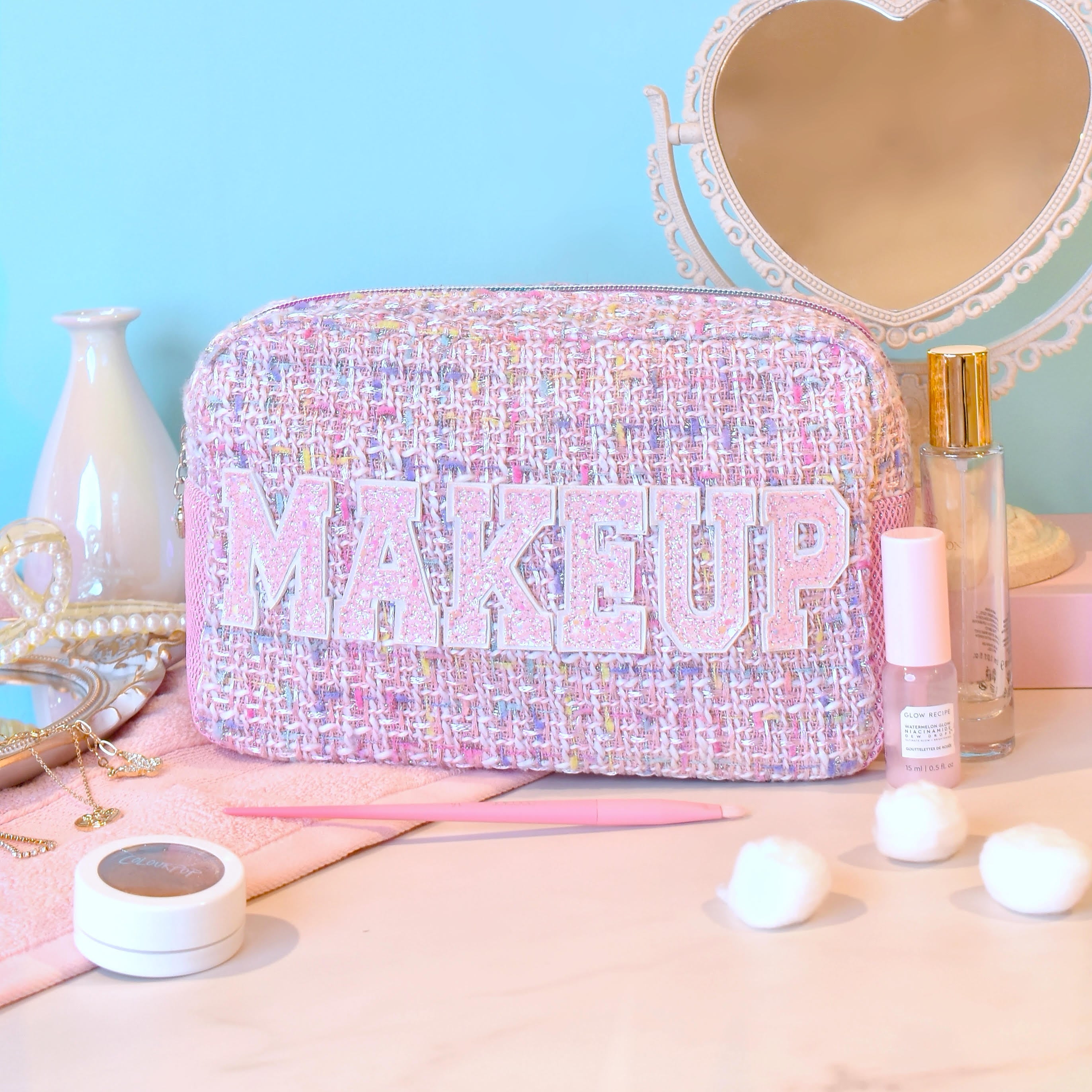 photo of pink tweed  pouch with glitter varsity lettering 'MAKEUP' appliqué 